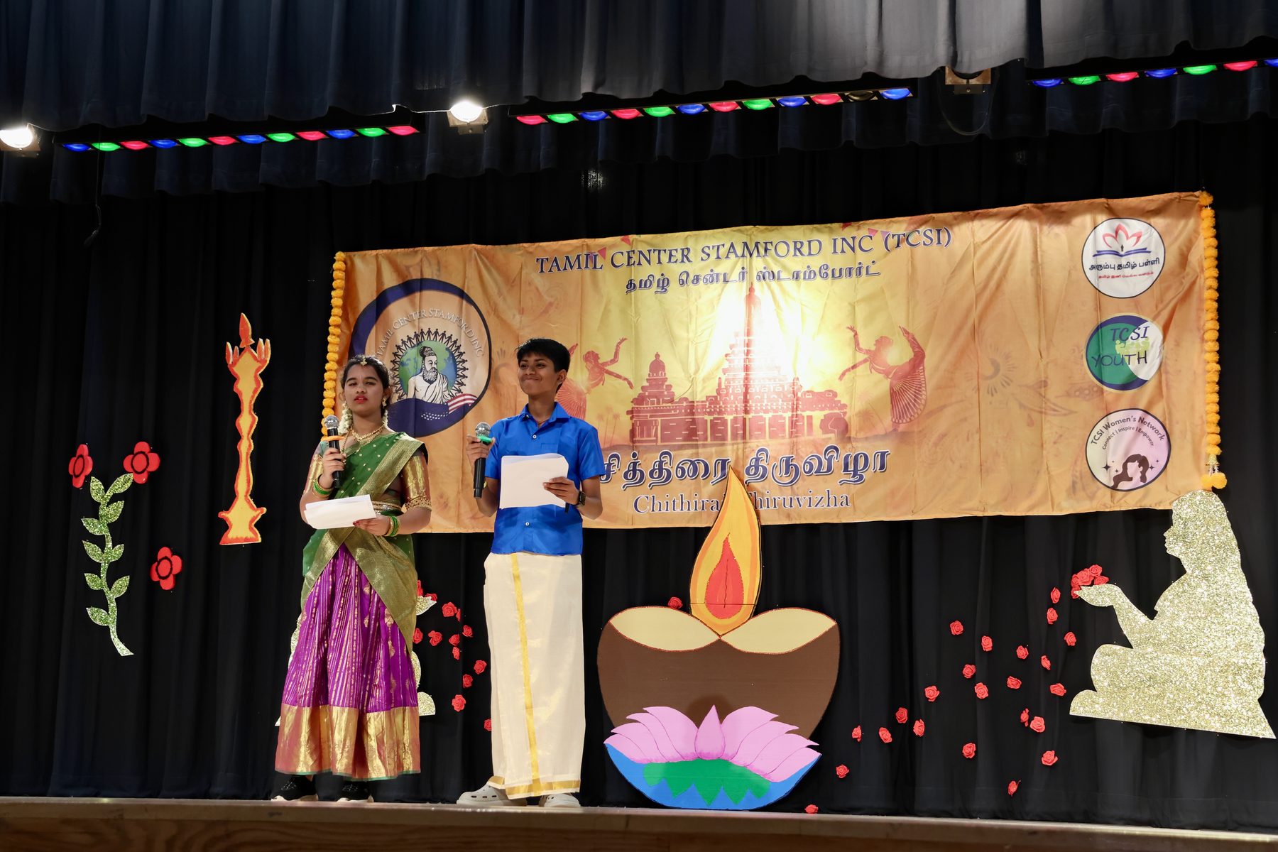 An Arumbu student hosting on stage