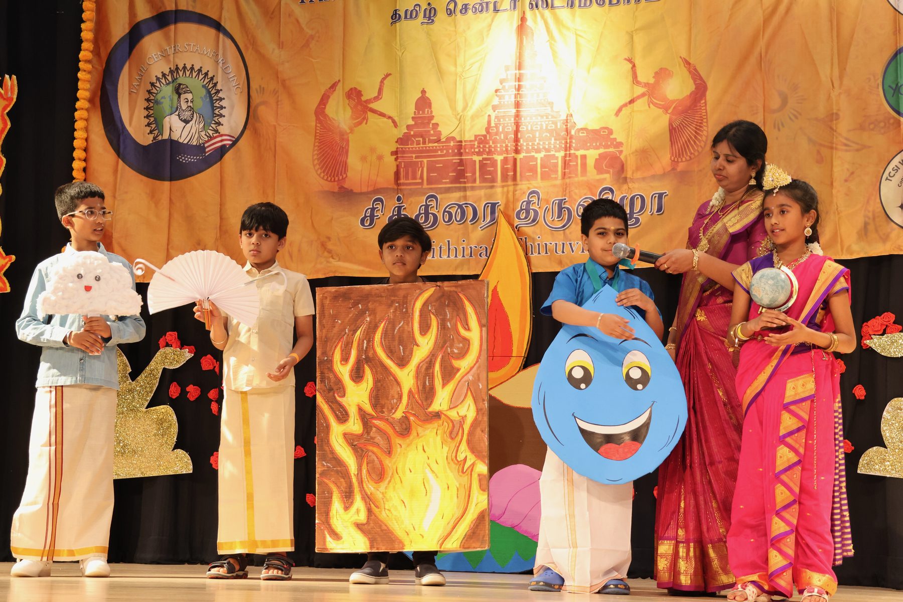 Arumbu students performing on stage